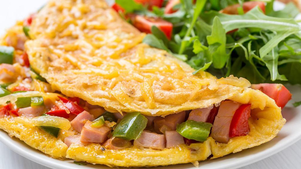 Greek Omelette · Fresh omelette made with feta cheese, onions and tomatoes.