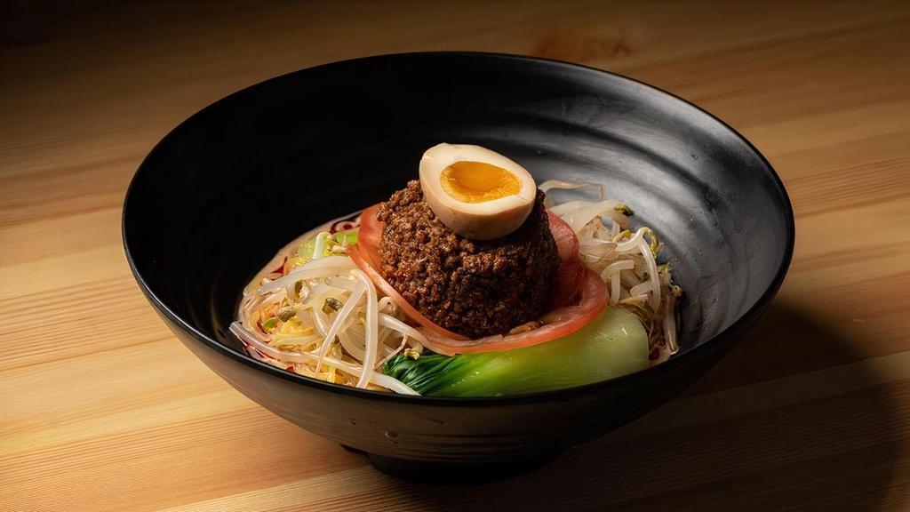 Cold Tan Tan Men · Chilled noodles topped with bean sprouts, bok choy, tomatoes, ground pork and soft boiled egg. Served with spicy seame peanut sauce