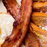 French Toast · 2 slices of French Toast, with eggs, bacon or sausage