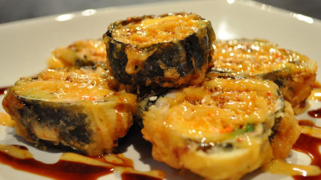 Samurai Roll · Hot. Spicy tuna, crunch, green onion, cucumber, topped with unagi, sweet tofu, special sauce. Spicy.