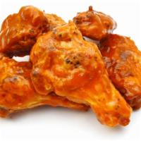 Buffalo Wings · Yummy juicy crispy wings tossed with buffalo sauce, served with fresh crispy hand-cut fries.