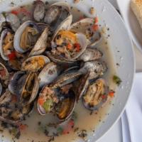 Steamers · Manila clams with garlic and herbs in our special white wine broth served with garlic bread