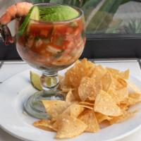 Mexican Shrimp Cocktail · Fresh chopped shrimp with spicy tomato juice, lime, pico de gallo, cucumber and avocado serv...
