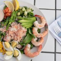 Seafood Louie · Mixed greens with crab, shrimp, avocado, asparagus, tomato, cucumber onions, roasted corn, h...