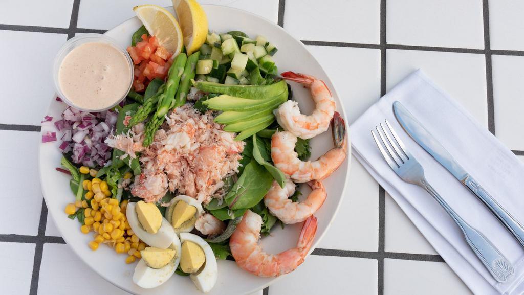Seafood Louie · Mixed greens with crab, shrimp, avocado, asparagus, tomato, cucumber onions, roasted corn, hard boiled egg lightly tossed in Louie dressing.