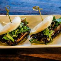 Chashu Bun (1Pc) · Steamed Bun filled with pork belly chashu, green onion, spring mix and sweet brown sauce