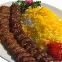Kabob Koobideh (2) W/ Rice · Two skewers of juicy strips of charbroiled, seasoned ground beef with basmati rice, tomato, ...