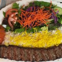 Kabob Koobideh (1) W/ Rice · One skewers of juicy strips of charbroiled, seasoned ground beef with basmati rice, tomato, ...