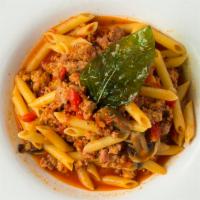 Penne Vittorio · Penne pasta with sausage, bell pepper, mushrooms in a spicy tomato sauce.