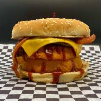 Western Bacon Cheeseburger · Sesame seed bun with BBQ sauce, a crispy onion ring, cheese, bacon, and a 1/4 lb patty.