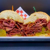 Pastrami Sandwich · French roll topped with pickles, mustard, and juicy pastrami.