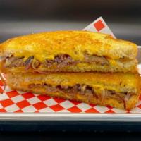 Patty Melt · Freshly grilled burger patty on rye bread topped with American cheese and grilled onions.