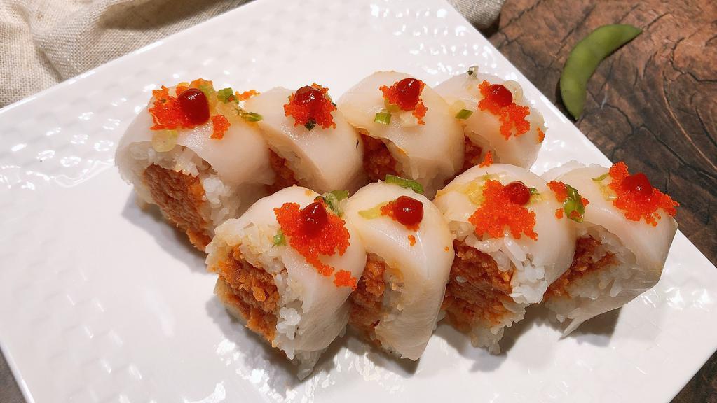 Hurricane Roll · Spicy. Spicy tuna inside wrapped in soy paper with white tuna, red onion, and masago. Chili oil house sauce on top.