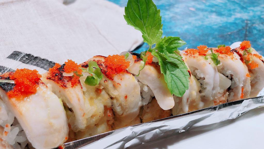 Snow Roll · Spicy. Baked crab. Avocado. Cream Cheese & White Fish topped with Masago & Green Onion