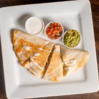 Quesadilla Famosa · A crispy flour tortilla stuffed with Jack and Cheddar cheeses, diced green chillies and serv...