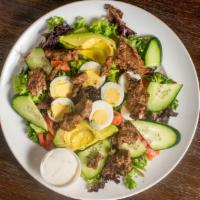 The Cobb Salad · Fresh spring mix greens, hard boiled egg, Roma tomatoes, cucumbers, crispy bacon, blue chees...