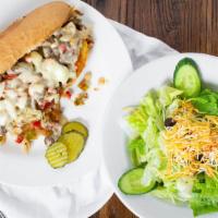Philly Steak And Cheese · Sauteed chopped rib eye steak, onions, bell peppers, topped with cheese and served on a hoag...