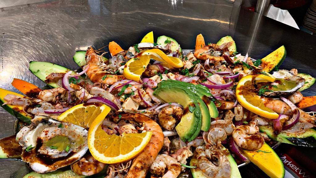 Botana Mixta · Mixed appetizer with shrimp, abalone, octopus, imitation crab, cucumbers and avocado.