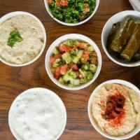 Side Combo Plate · Tabbouleh, Hummus, Baba-Ganoush, Grape Leaves, Shirazi Salad & Tzatziki Served with Pita Bre...