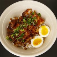 Adobo Bowl · Braised pork belly, adobo sauce, soft boiled egg, scallions, and rice.
