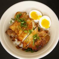 Fried Chicken Adobo · Boneless chicken thigh, signature adobo sauce, soft boiled egg, and scallions.