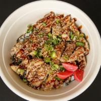 Karaage Rice Bowl · Japanese fried chicken, umami gravy, seaweed, scallions, sesame seed, and pickled red radish.