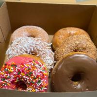 Half Dozen Mix · Usually 6 round donuts, or 4 round and 2 long donuts.