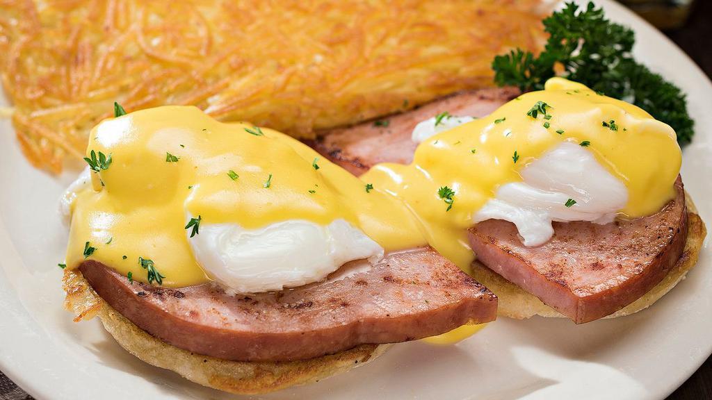 Eggs Benedict · Smoked ham and poached eggs on an English muffin topped with creamy hollandaise sauce and served with choice of potato.