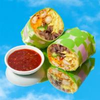 Carne Asada Breakfast Burrito · Eggs, carne asada, tater tots, melted cheese, caramelized onions, avocado.