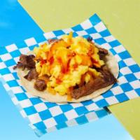 Carne Asada Breakfast Taco · Eggs, carne asada, melted cheese, salsa.