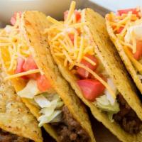 Ground Beef Hard Shell Taco · Seasoned ground beef, pico de gallo, cheese, lettuce, and cream, served in a crispy tortilla...