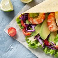 Fish & Shrimp Burrito · Fresh caught white fish and prawns, rice, beans, cabbage, pico de gallo, and cream wrapped i...