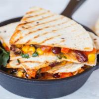 Chicken Quesadilla · Delicious juicy chicken and cheese with house special fiesta filling in a folded tortilla.