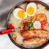 Ramen · Tonkotsu ramen with fresh noodles, chashu pork, slow roasted tomato, medium boiled egg, fish...