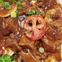 Brisket  & Gravy · Braised brisket with gravy, served over rice.  Low carb option available.