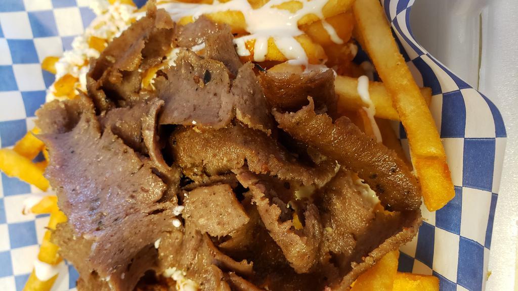Gyro Fries · Our seasoned fries topped with whipped feta and Chicago gyro meat served with Greek island sauce and tzatziki.