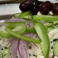 Village Salad · Horiatiki. Fresh tomatoes, red onions, cucumbers, sweet peppers, Greek peppers, feta and Kal...