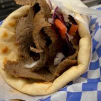 Chicago Style Gyro · Layered beef and lamb seasoned with Greek spices and cooked on our vertical broilers.