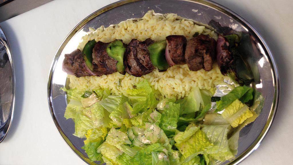 Charbroiled Beef Skewer · Greek style marinated beef sirloin skewer with bell peppers and onions.