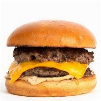 (Um) Double Umami Burger · Smashed Double Patties, Dashi Onions, American Cheese, Pickle Chips, Umami Sauce on a Squish...