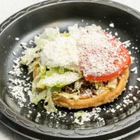 Beans Sope · Served with beans, lettuce, sour cream, cheese, and tomato.