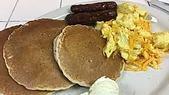 Pancake Combo · Three fluffy made-from-scratch buttermilk pancakes served with two eggs and your choice of t...