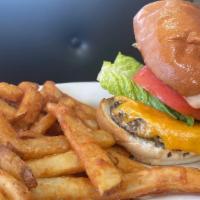 Cheeseburger · One-third pound grilled black angus beef patty, topped with melted cheddar cheese, vine-ripe...