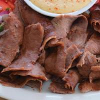 # 7 Beef Shawarma · Slow roasted & thinly shaved marinated Black Angus beef with our house spices, hummus, tahin...