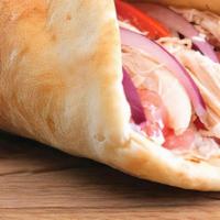 # 13 Roasted Chicken Wrap · Marinated chicken, tomatoes, garlic sauce wrapped in freshly baked pita bread.