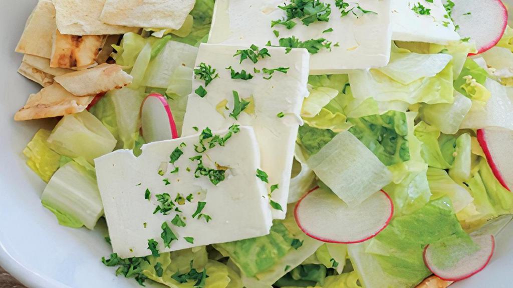 Tahini Caesar Salad · Romaine lettuce, vegan feta, garlic, roasted chick peas.