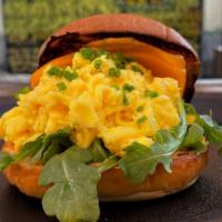 Breakfast Sandwich · Three cage free eggs scrambled, sharp cheddar, arugula, chipotle aioli, brioche bun.