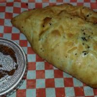 Chicken & Bacon  Calzone · Garlic chicken, bacon crumbles, red onions, assorted peppers and melted cheese with alfredo ...