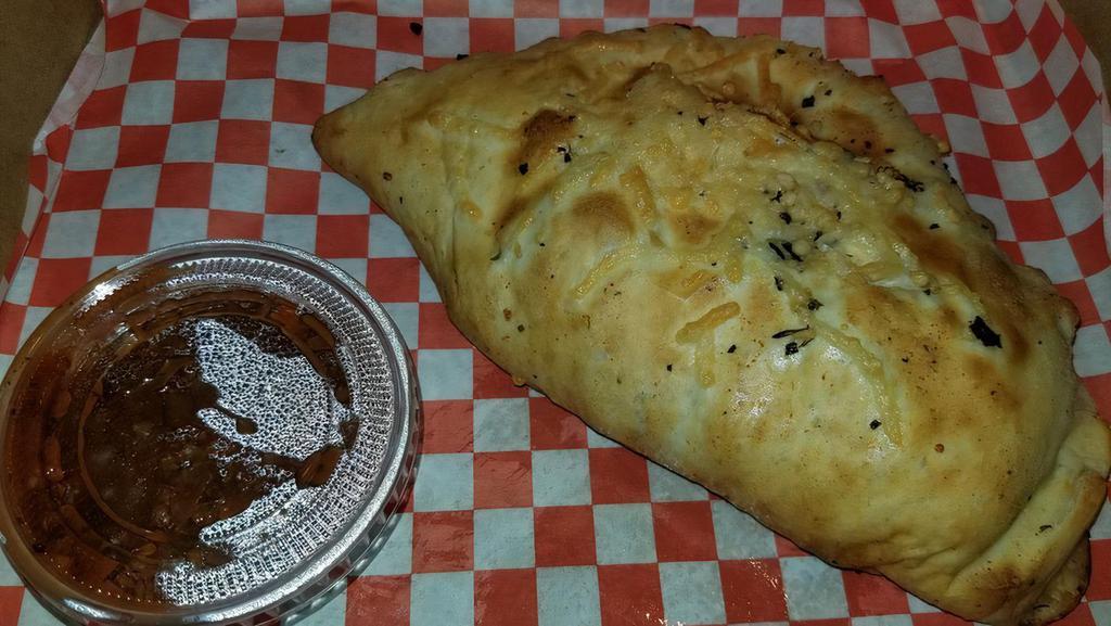 Chicken & Bacon  Calzone · Garlic chicken, bacon crumbles, red onions, assorted peppers and melted cheese with alfredo sauce.