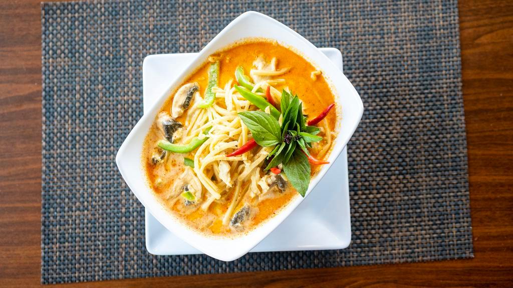 Red Curry  (Gang Gai) · Choice of meat in Thai red curry with coconut milk, bamboo shoots, bell peppers, basil leaves, and mushroom.